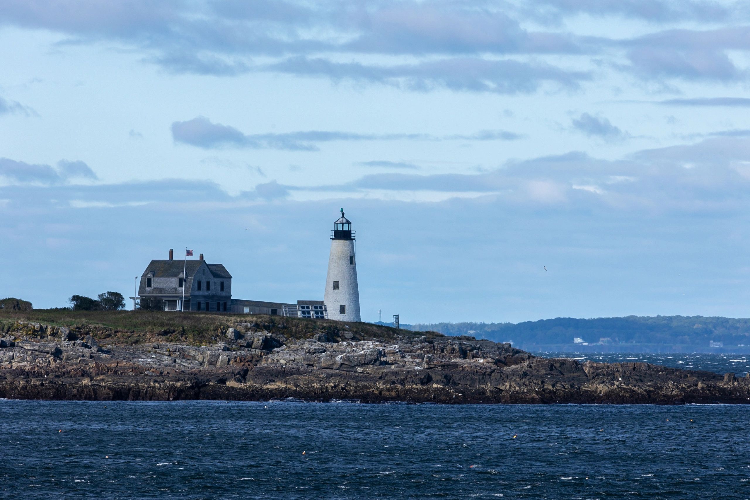 Wood Island Lighthouse above a wind-whipped sea